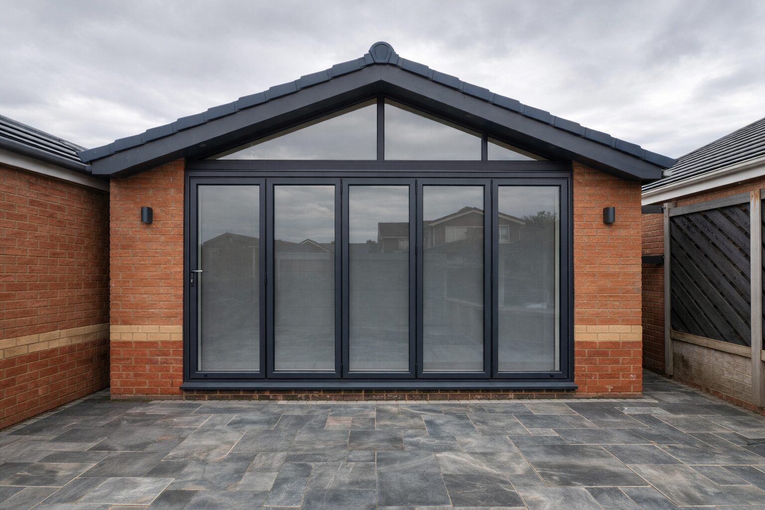 Home Anthracite bi-fold doors on a brick extension